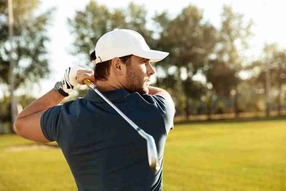Close Up Young Concentrated Man Shooting Golf Ball | Avant Orthopaedics