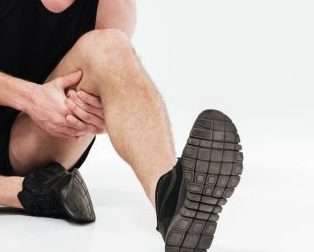 Foot &Amp; Ankle Pain: Symptoms, Causes And Diagnosis 4 Sad Young Sportsman Sitting Isolated Have Painful Feelings | Avan T Orthopaedics